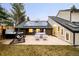 Backyard patio featuring outdoor seating, hot tub, and solar panels on roof at 3970 Longwood Ave, Boulder, CO 80305
