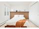 Modern bedroom with wood panel headboard and bright, natural lighting at 3970 Longwood Ave, Boulder, CO 80305