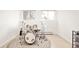 Bonus room with drum set, hardwood floors, and bright windows at 3970 Longwood Ave, Boulder, CO 80305