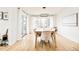 Bright dining room featuring a modern light fixture and large windows at 3970 Longwood Ave, Boulder, CO 80305