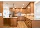 Well-lit kitchen features granite countertops, wooden cabinetry and stainless steel appliances at 3970 Longwood Ave, Boulder, CO 80305