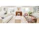 Bright living room featuring a piano, modern sofa, and floral armchairs at 3970 Longwood Ave, Boulder, CO 80305