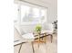 Cozy sitting area with natural light from large windows with views of trees at 3970 Longwood Ave, Boulder, CO 80305