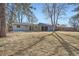 Expansive backyard featuring a covered patio and mature trees, offering privacy and space for outdoor activities at 6635 S Sherman St, Centennial, CO 80121