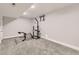 Finished basement space with carpet and a window. Room features a weights machine at 6635 S Sherman St, Centennial, CO 80121