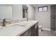 Modern bathroom featuring double sinks with granite countertops and tiled walk-in shower at 6635 S Sherman St, Centennial, CO 80121