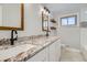 Updated bathroom featuring dual sinks, granite counters, updated lighting and modern fixtures at 6635 S Sherman St, Centennial, CO 80121