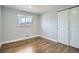 Cozy bedroom featuring hardwood floors and a window with natural light at 6635 S Sherman St, Centennial, CO 80121