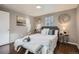 Comfortable bedroom with neutral tones and plenty of light at 2925 S Ingalls Way, Denver, CO 80227