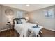 Serene bedroom with soft lighting and ample natural light at 2925 S Ingalls Way, Denver, CO 80227