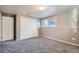 Cozy bedroom with carpeted floors, neutral walls, and a closet for storage at 2925 S Ingalls Way, Denver, CO 80227
