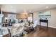 Bright living room with hardwood floors and comfortable seating at 2925 S Ingalls Way, Denver, CO 80227