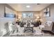 Cozy living room featuring modern decor, neutral colors, and ample natural light at 2925 S Ingalls Way, Denver, CO 80227