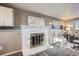 Comfortable living room showcasing a fireplace, modern decor, and neutral color palette at 2925 S Ingalls Way, Denver, CO 80227