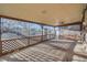Relaxing screened-in porch offering ample space, sun-drenched sunlight, and lattice design at 2925 S Ingalls Way, Denver, CO 80227