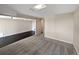 Spacious basement area with a mix of carpet and sleek tile flooring, perfect for versatile use at 2418 W 82Nd Pl # D, Westminster, CO 80031