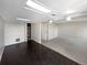 Basement featuring mixed flooring, ample lighting, and potential for customization at 2418 W 82Nd Pl # D, Westminster, CO 80031