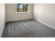 Neutral bedroom with a carpeted floor and a bright window offering natural light at 2418 W 82Nd Pl # D, Westminster, CO 80031