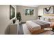 Cozy bedroom featuring a large window with lush greenery and a minimalist modern design style at 2418 W 82Nd Pl # D, Westminster, CO 80031