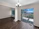 Dining area with stylish hardwood floors and sliding glass doors to a private balcony with great views at 2418 W 82Nd Pl # D, Westminster, CO 80031