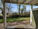 Outdoor patio area looking out to a grassy lawn and trees at 2418 W 82Nd Pl # D, Westminster, CO 80031