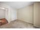 Neutral bedroom with carpet flooring, closet, and door leading to a room with wood flooring at 395 Raspberry Ln, Monument, CO 80132