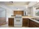 Bright kitchen featuring modern appliances, wood cabinets, and view of the living space at 395 Raspberry Ln, Monument, CO 80132