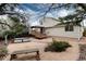 Spacious gravel backyard featuring a charming deck, perfect for outdoor relaxation and entertaining at 8129 Locust Dr, Littleton, CO 80125