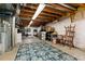 Unfinished basement space offering potential for a home gym, storage, or flexible use at 8129 Locust Dr, Littleton, CO 80125