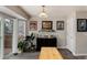 Bright dining area featuring a sliding glass door to the deck, wood floors, and stylish decor at 8129 Locust Dr, Littleton, CO 80125