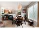 Cozy dining area with seating for four, flowing into the kitchen at 8129 Locust Dr, Littleton, CO 80125