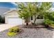 Charming home featuring manicured landscaping and an attached two-car garage at 8129 Locust Dr, Littleton, CO 80125