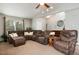 Bright and inviting living room with large windows and ample seating space at 8129 Locust Dr, Littleton, CO 80125