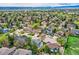 Aerial view of a residential neighborhood featuring well-maintained homes and lush greenery at 5305 W Lake Pl, Littleton, CO 80123