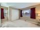 Bedroom with carpet, natural light, closet and burgundy curtains at 5305 W Lake Pl, Littleton, CO 80123