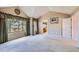 Large bedroom with vaulted ceilings, neutral carpet, and many windows with backyard views at 5305 W Lake Pl, Littleton, CO 80123