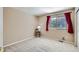 Bedroom with carpet, natural light, and burgundy curtains at 5305 W Lake Pl, Littleton, CO 80123