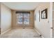 Neutral bedroom with carpet flooring, a window with blinds, and beige walls at 5305 W Lake Pl, Littleton, CO 80123