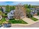 Charming two-story home with well-manicured lawn, beautiful landscaping, and a two-car garage at 5305 W Lake Pl, Littleton, CO 80123
