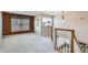 Upstairs loft area with a large window offering natural light and views, perfect as a flexible living space at 5305 W Lake Pl, Littleton, CO 80123