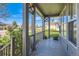Cozy porch with grey support columns and ample natural light at 5305 W Lake Pl, Littleton, CO 80123