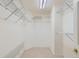Spacious walk-in closet with ample shelving for organized storage and convenient access to wardrobe essentials at 5305 W Lake Pl, Littleton, CO 80123