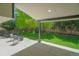 Inviting backyard patio with comfortable seating and lush greenery, creating a serene outdoor retreat at 6488 Tilbury Ave, Firestone, CO 80504
