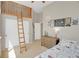 Bedroom with a high ceiling, loft area and a charming decor at 6488 Tilbury Ave, Firestone, CO 80504