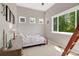 Bright bedroom boasts large windows and charming decor at 6488 Tilbury Ave, Firestone, CO 80504
