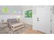 Bright foyer with modern decor, light wood floors, and natural light that creates an inviting atmosphere at 6488 Tilbury Ave, Firestone, CO 80504