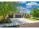 Charming two-story home featuring a manicured lawn, stone accents, and a spacious three-car garage at 6488 Tilbury Ave, Firestone, CO 80504