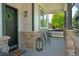 Inviting front porch with charming decor, stone accents, and comfortable seating area to enjoy the outdoors at 6488 Tilbury Ave, Firestone, CO 80504