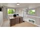 Bright open office with natural light featuring a ceiling fan and dark wood executive desk at 6488 Tilbury Ave, Firestone, CO 80504