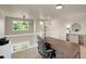 Bright open office with a ceiling fan and view of the lower level from the upper level at 6488 Tilbury Ave, Firestone, CO 80504